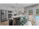 This gourmet kitchen has stainless steel appliances, breakfast bar, and access to the pool at 8070 Johnson Rd, Palmetto, GA 30268