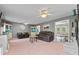Spacious living room featuring two sofas and decor with a view into the dining area at 8070 Johnson Rd, Palmetto, GA 30268