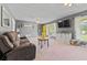 Inviting living room with modern gray walls, soft carpet, and stylish furniture at 8070 Johnson Rd, Palmetto, GA 30268