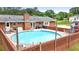 Backyard featuring an in-ground pool with a brick surround and lounge area at 8070 Johnson Rd, Palmetto, GA 30268