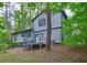 Beautiful backyard featuring a wooden deck, perfect for outdoor entertaining and relaxation at 129 Lester Nw Rd, Lawrenceville, GA 30044