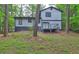Beautiful backyard featuring a wooden deck, perfect for outdoor entertaining and relaxation at 129 Lester Nw Rd, Lawrenceville, GA 30044