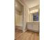 Bathroom featuring a vanity and a view into a separate shower and tub area at 129 Lester Nw Rd, Lawrenceville, GA 30044