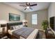 Comfortable bedroom featuring a ceiling fan and ample natural light at 129 Lester Nw Rd, Lawrenceville, GA 30044