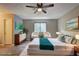 This staged bedroom is spacious, and features hardwood floors, a ceiling fan, and neutral walls at 129 Lester Nw Rd, Lawrenceville, GA 30044