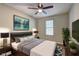 Comfortable bedroom featuring a ceiling fan and ample natural light at 129 Lester Nw Rd, Lawrenceville, GA 30044