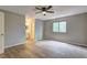 Spacious bedroom featuring hardwood floors, ceiling fan, and neutral walls at 129 Lester Nw Rd, Lawrenceville, GA 30044