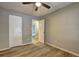 Unfurnished bedroom, showing the closets, light and door to the bathroom at 129 Lester Nw Rd, Lawrenceville, GA 30044