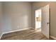 Bedroom with a connecting door, hardwood floors, with plenty of open space at 129 Lester Nw Rd, Lawrenceville, GA 30044
