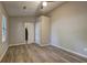 Spacious bedroom featuring hardwood floors, ceiling fan, neutral walls and two large closets at 129 Lester Nw Rd, Lawrenceville, GA 30044