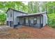 Charming home with a inviting front porch and swing, surrounded by lush greenery at 129 Lester Nw Rd, Lawrenceville, GA 30044