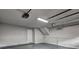 Spacious two-car garage with updated lighting and freshly painted walls, perfect for storage or workshop at 129 Lester Nw Rd, Lawrenceville, GA 30044