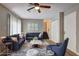 Nicely staged living room with hardwood floors, staircase, neutral paint, and lots of natural light at 129 Lester Nw Rd, Lawrenceville, GA 30044