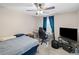 Cozy bedroom with neutral walls and fan at 202 Berkeley Woods Dr, Duluth, GA 30096