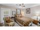 Inviting bedroom with natural light, cozy armchair, and tasteful decor at 202 Berkeley Woods Dr, Duluth, GA 30096