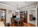 Dining room with dark wood table set, china cabinet, and decorative accents at 202 Berkeley Woods Dr, Duluth, GA 30096
