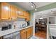 Bright kitchen with granite countertops and appliances offers a view into the connected dining area at 202 Berkeley Woods Dr, Duluth, GA 30096