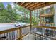 Cozy outdoor patio area with metal furniture and views of the parking area and surrounding trees at 202 Berkeley Woods Dr, Duluth, GA 30096