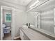 Elegant bathroom features a double vanity with modern fixtures and a separate toilet area at 2676 Abington Dr, Snellville, GA 30078