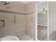 Bathroom showcasing updated tile shower and view into bedroom at 2676 Abington Dr, Snellville, GA 30078