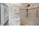 Bathroom with updated vanity, mirror, and tiled shower at 2676 Abington Dr, Snellville, GA 30078