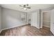 Bedroom with hardwood floors, closet, window and ensuite bath at 2676 Abington Dr, Snellville, GA 30078