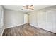 A spacious bedroom with hardwood floors and a large closet with light gray walls at 2676 Abington Dr, Snellville, GA 30078