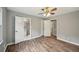 Bedroom with hardwood floors, neutral paint, and bathroom access at 2676 Abington Dr, Snellville, GA 30078