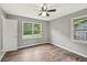 Bedroom featuring hardwood floors and two windows providing natural light at 2676 Abington Dr, Snellville, GA 30078
