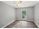 Bedroom with hardwood floors and a window providing natural light at 2676 Abington Dr, Snellville, GA 30078
