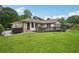 Lovely single-story home with brick and siding exterior, a ramp, and a lush green lawn at 2676 Abington Dr, Snellville, GA 30078