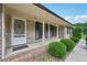 Inviting covered front porch with classic white columns and decorative accents at 2676 Abington Dr, Snellville, GA 30078