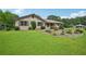 Well-maintained home featuring lush green lawn and mature trees at 2676 Abington Dr, Snellville, GA 30078