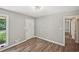 Bright living room featuring hardwood floors, neutral paint, and abundant natural light at 2676 Abington Dr, Snellville, GA 30078