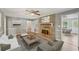 Cozy living room featuring a brick fireplace and neutral furniture, perfect for relaxation and entertaining at 2676 Abington Dr, Snellville, GA 30078