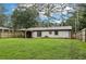 Large fenced backyard featuring a covered patio, providing ample space for outdoor activities and relaxation at 3351 Landrum Se Dr, Smyrna, GA 30082