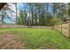 Large backyard with a wooden fence, offering privacy and space for various outdoor activities and landscaping at 3351 Landrum Se Dr, Smyrna, GA 30082