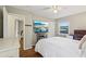 Bedroom with hardwood floors and a TV and adjacent room that could be used as an office at 3351 Landrum Se Dr, Smyrna, GA 30082