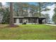 Charming single-story home featuring a cozy front porch and freshly landscaped yard with mature trees at 3351 Landrum Se Dr, Smyrna, GA 30082