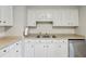 Bright kitchen featuring white cabinetry, stainless steel appliances, and double basin sink at 3351 Landrum Se Dr, Smyrna, GA 30082