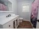 Bathroom featuring vanity with a mirror, modern sink, and a colorful shower curtain at 7505 Rico Rd, Chattahoochee Hills, GA 30268