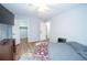 Bedroom with carpet, two closets, and open doorway to another bedroom at 7505 Rico Rd, Chattahoochee Hills, GA 30268
