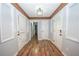Entryway features a stylish ceiling fixture and new flooring creating a lasting impression at 7505 Rico Rd, Chattahoochee Hills, GA 30268