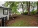 Wooden deck and green lawn, providing a relaxing space for outdoor enjoyment at 7505 Rico Rd, Chattahoochee Hills, GA 30268