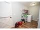 Functional laundry room with washer, dryer, utility sink and convenient shelving at 7505 Rico Rd, Chattahoochee Hills, GA 30268