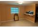 Well-lit dining room with a window and vintage wood trim at 1681 Sw Hammond Woods Sw Cir, Marietta, GA 30008