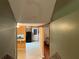 Hallway with view of kitchen and doorway to the adjacent living room at 1681 Sw Hammond Woods Sw Cir, Marietta, GA 30008
