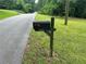 Mailbox with address number 1681 on a sunny and wooded lot at 1681 Sw Hammond Woods Sw Cir, Marietta, GA 30008