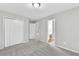 A bedroom featuring fresh paint, new carpet and a walk-in closet with an attached bathroom at 327 Oakland Bay Ct, Loganville, GA 30052