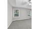 View of main bedroom with tray ceilings and neutral color scheme with carpet at 327 Oakland Bay Ct, Loganville, GA 30052